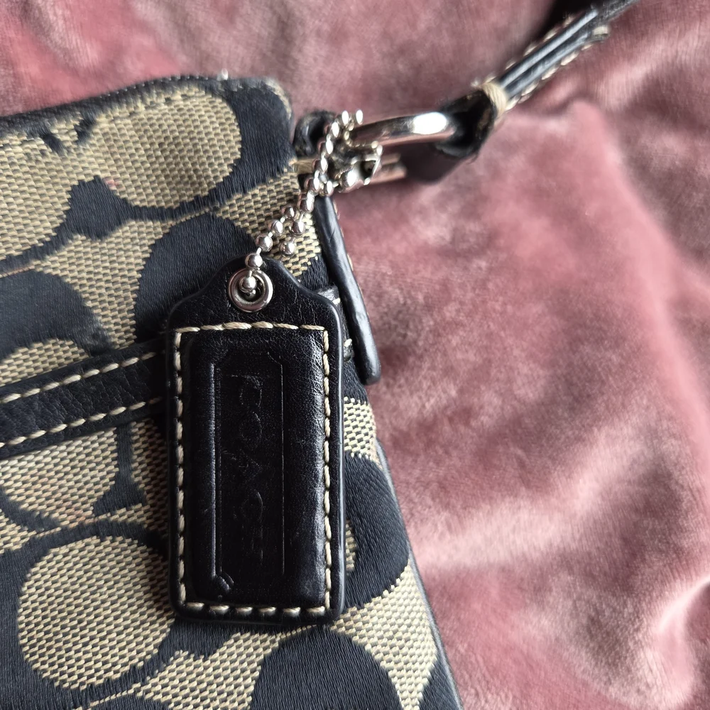 Authentic Coach Monogram Crossbody bag.
